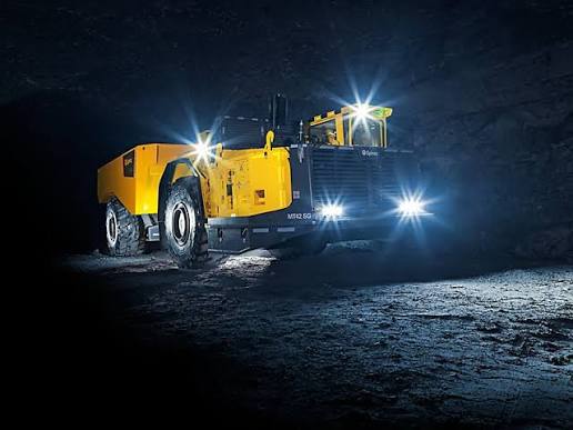 Underground mining haul truck with dramatic lighting in a Canadian mine tunnel